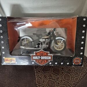 Harley-Davidson Motorcycle Model with Gold and Black Details.